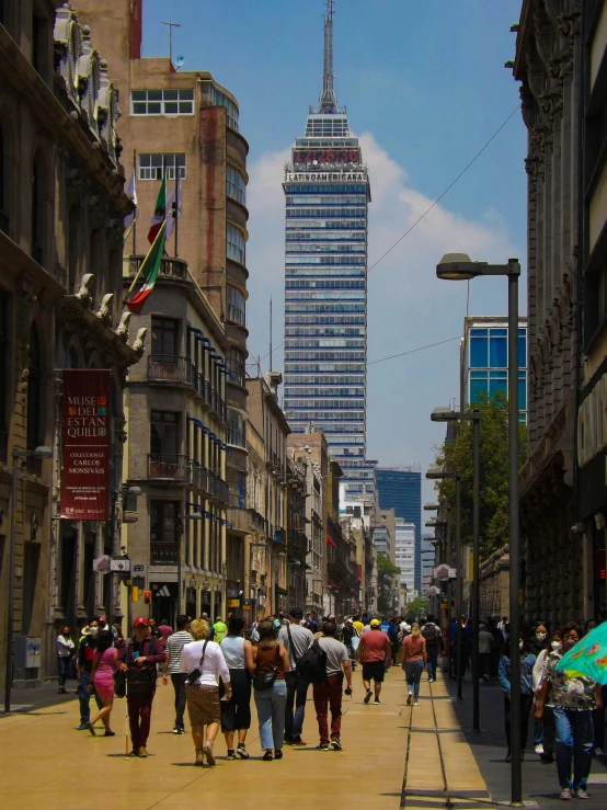 the crowd of people walking on the street is very crowded