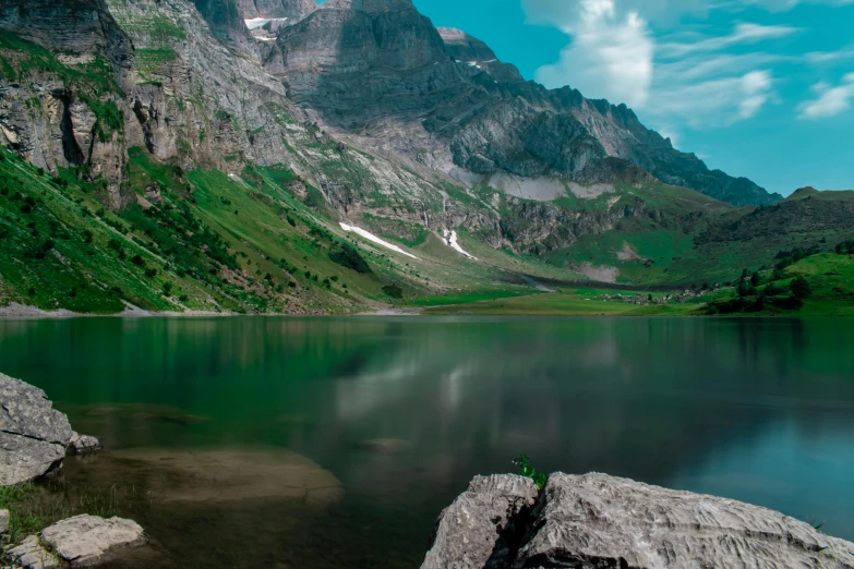 the rocky mountains are reflected in the crystal lake