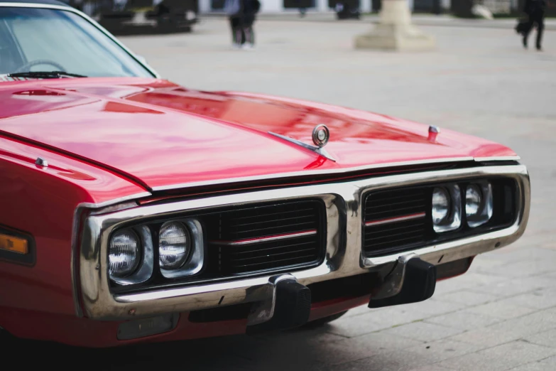 a close up of the front lights on a classic car