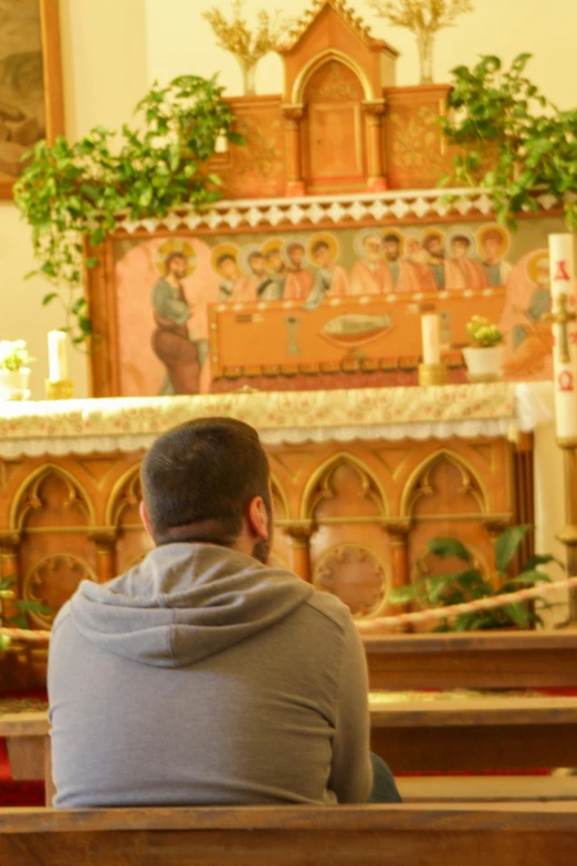 a person sitting in a church near a window