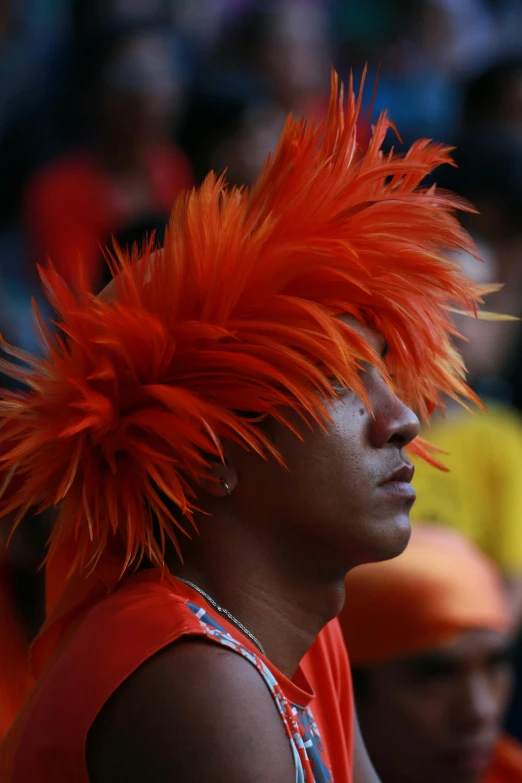 a man with red hair in a crowd