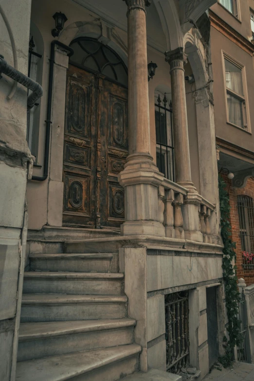 a stairway going to an old building with stone steps