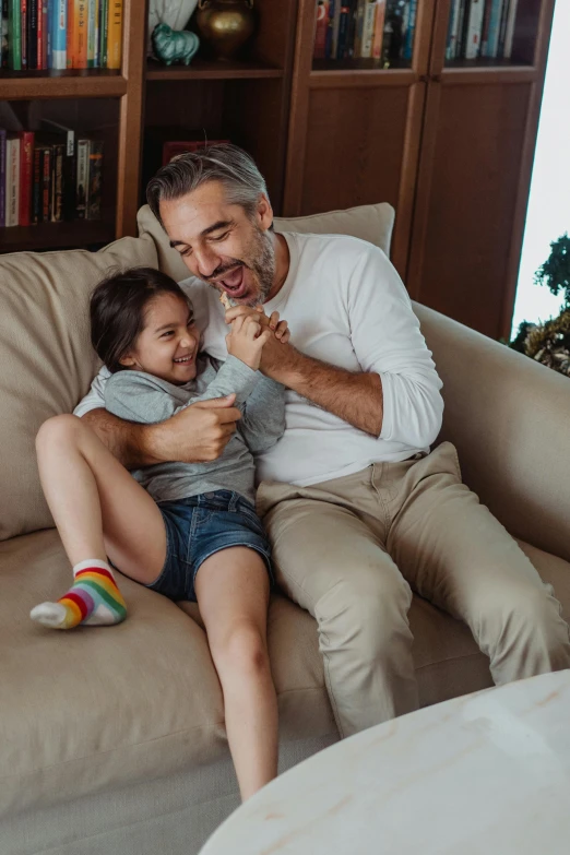 a man and a  sitting on the couch together