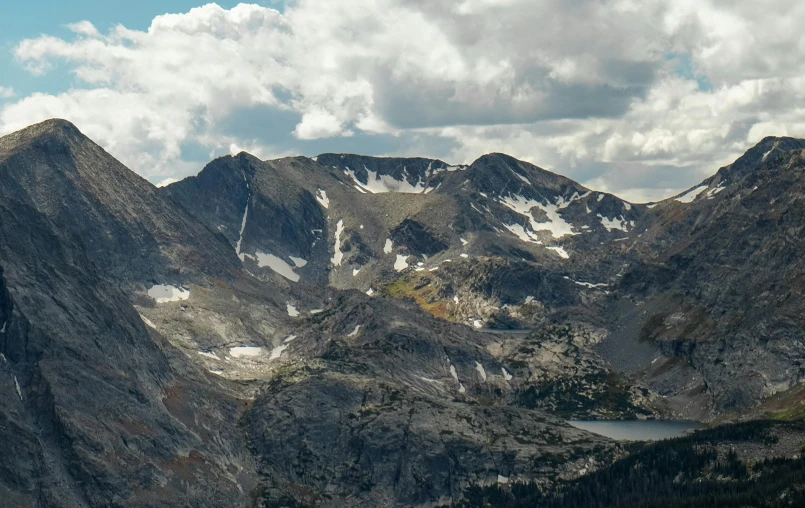 a wide view of a mountain range and lakes