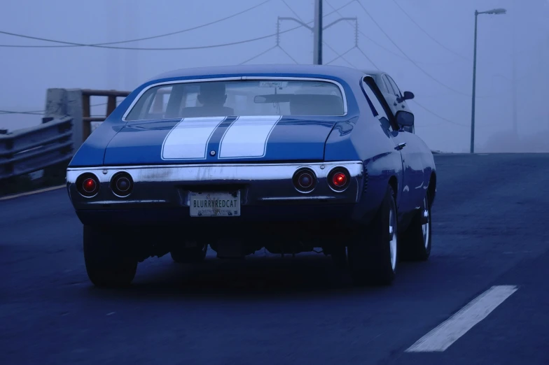 a blue and white car with white stripes