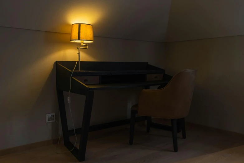 a desk lamp is set up beside the desk
