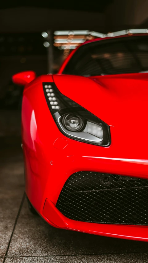 a close up image of a red sports car