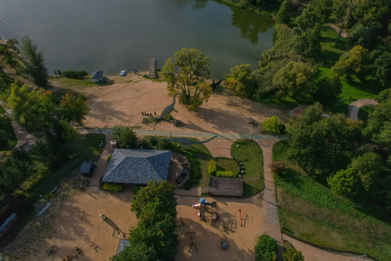 an aerial view of the pond and surrounding park