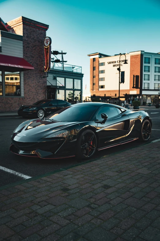 a bugatti is parked on a street corner in front of a row of buildings