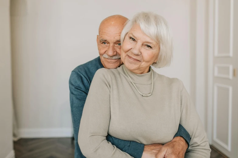 an older couple posing for a picture