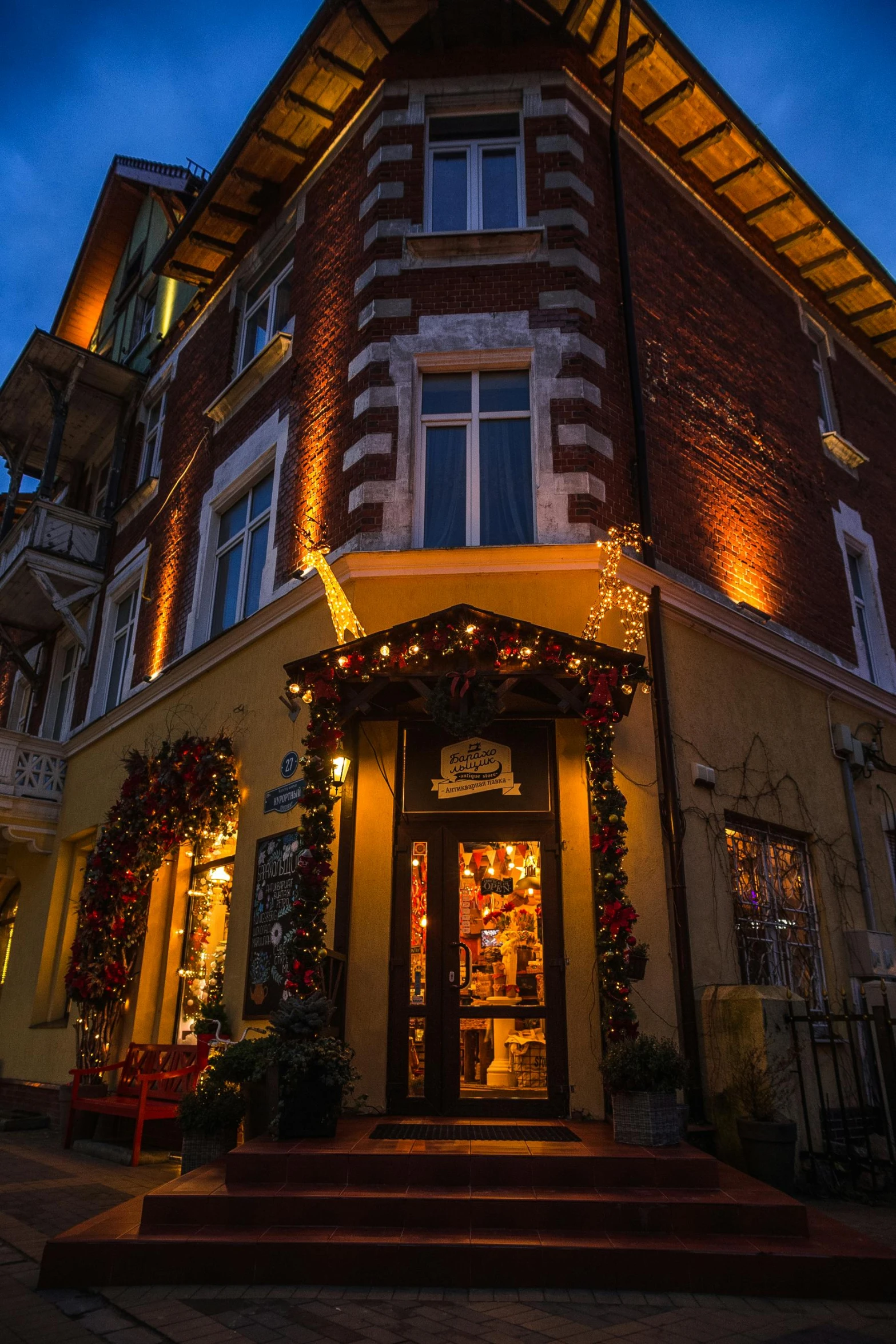 a tall building covered in christmas decorations