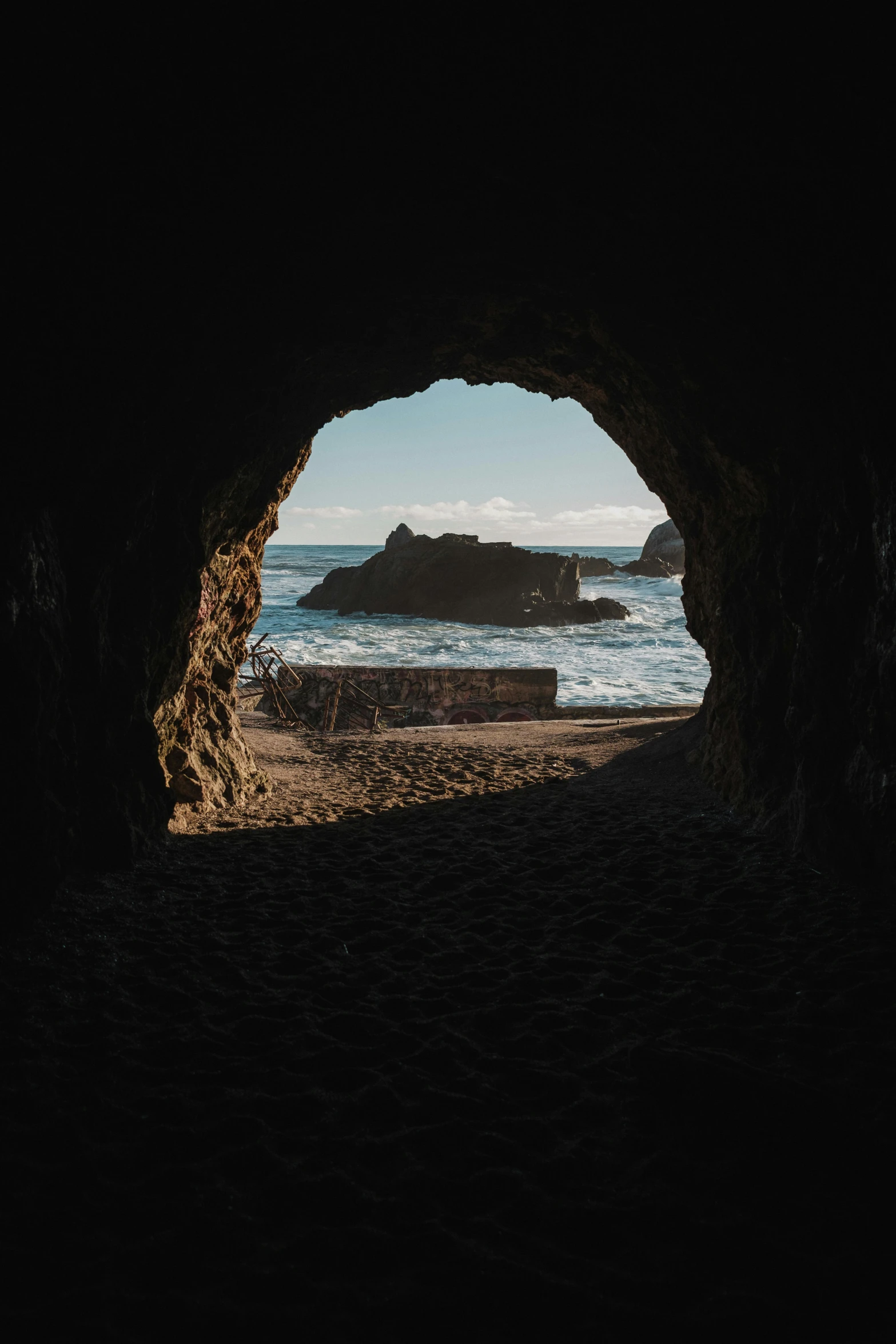 a dark cave with water inside it