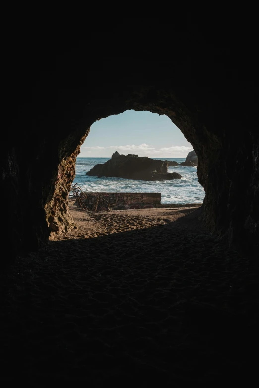 a dark cave with water inside it