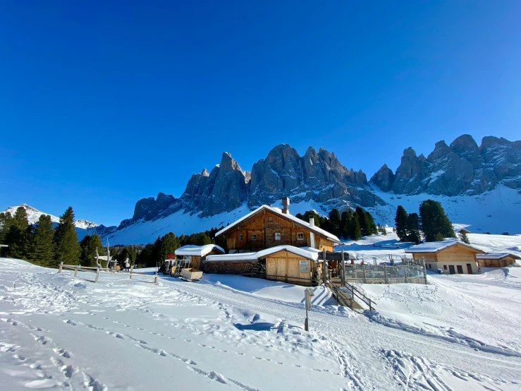 some ski lodge with mountains in the background