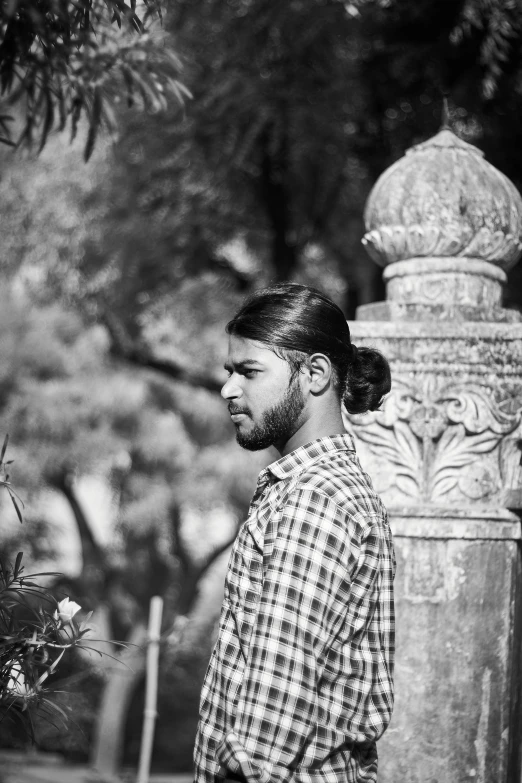 black and white pograph of man in plaid shirt