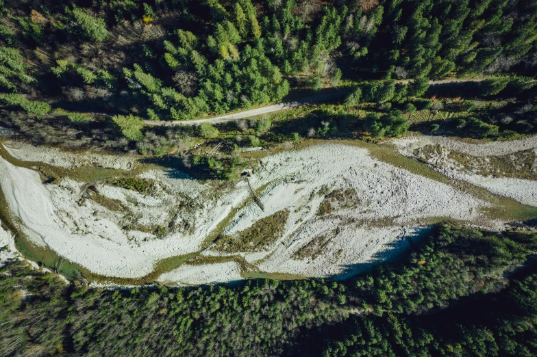 the view from above of some snowy hills