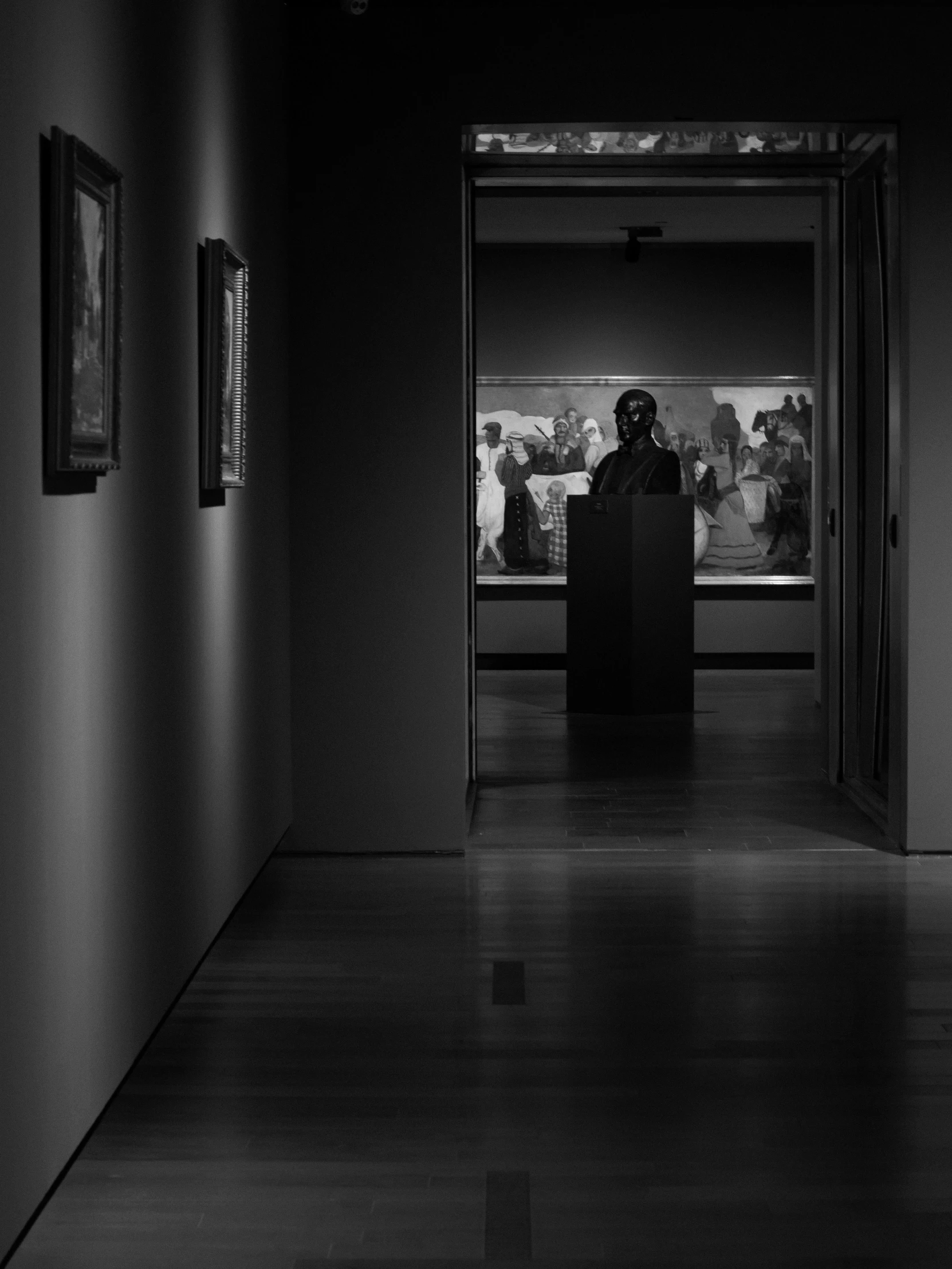 a person standing in a room with dark lighting