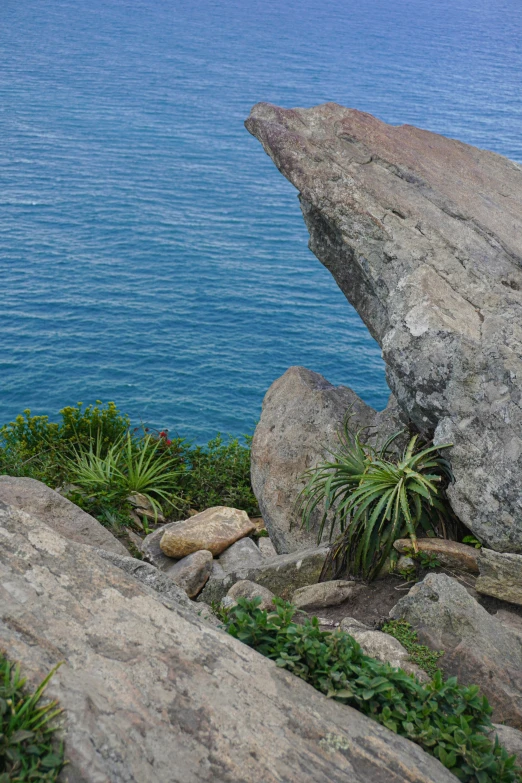 an area that is not very rocky with a cliff and water