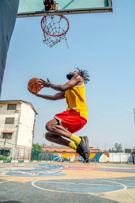 a basketball player leaping in the air for a dunk