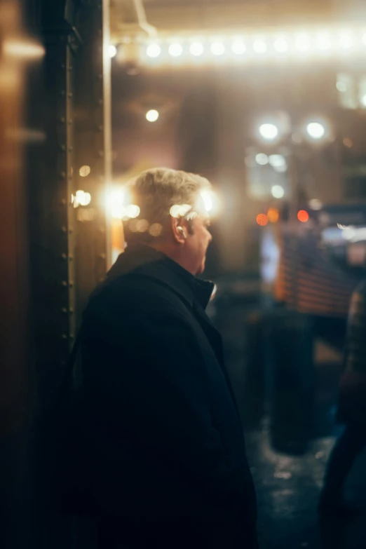 the back of a man's head looking at the ground