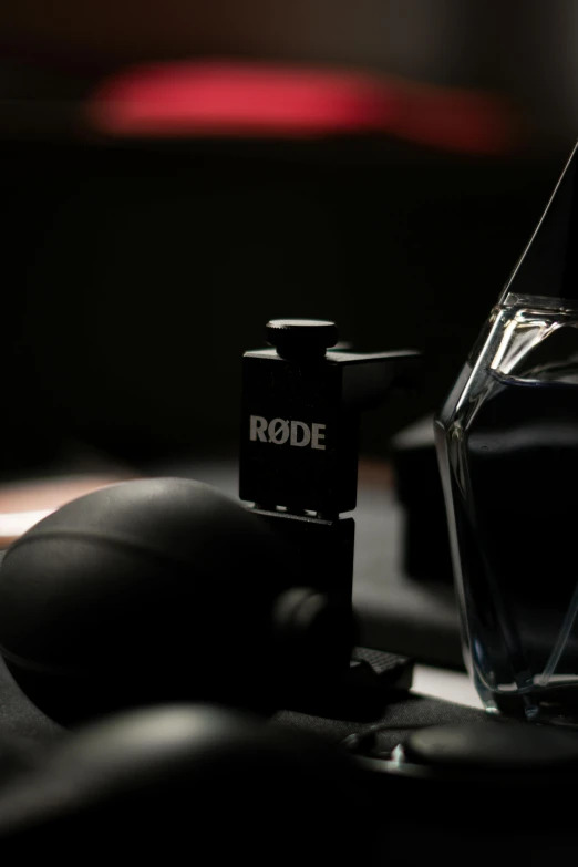 the name rodeo is on the bottle next to a computer mouse