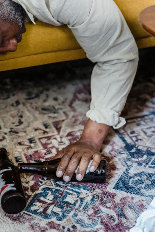 a person laying down on the floor holding an object