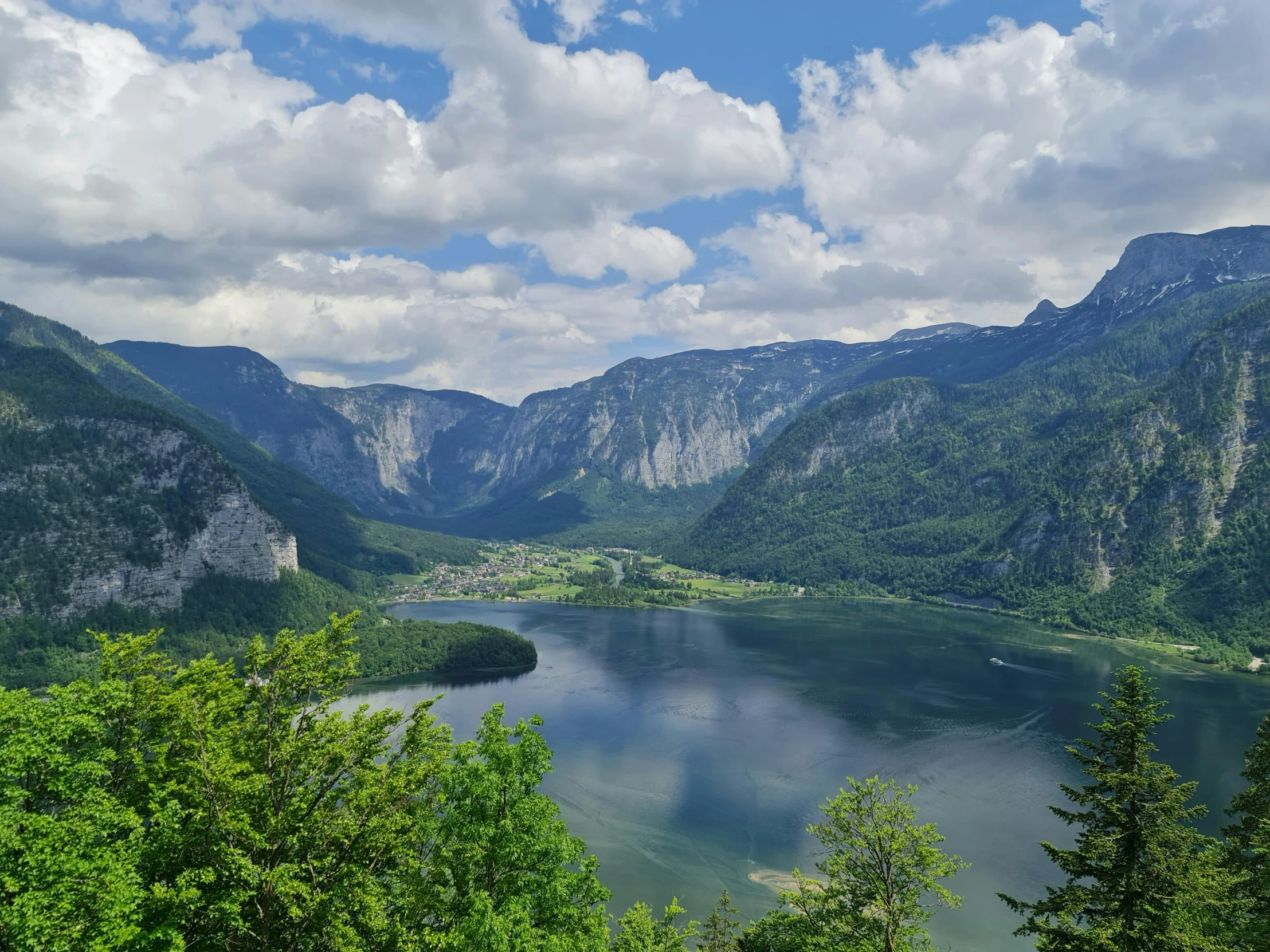 a po taken from above a lake with mountains in the background