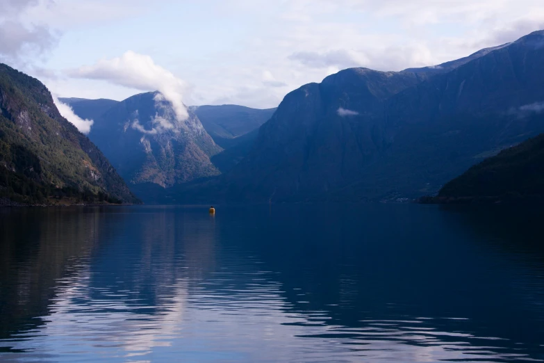 an image of a lake in the mountains that are very calm