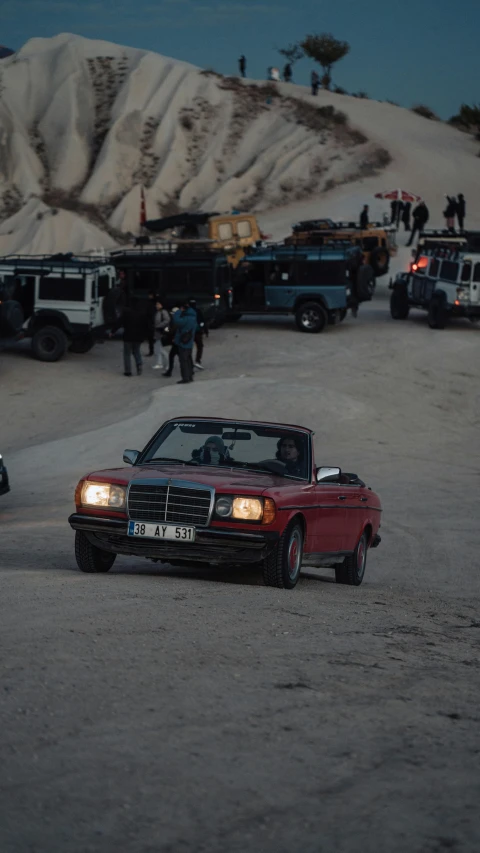 an automobile and a truck in a parking lot