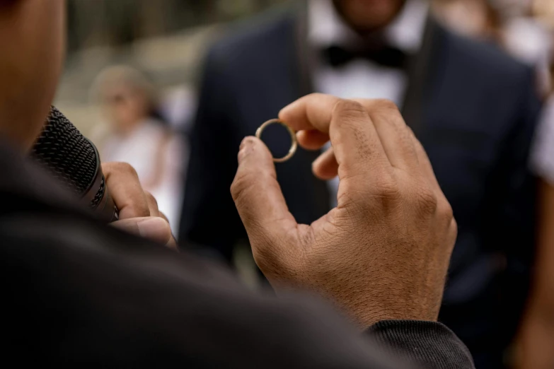 someone is trying to make their own band of tiny gold rings