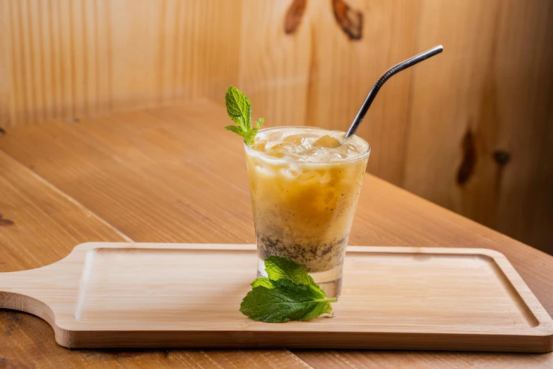 a drink sits on a tray on a table