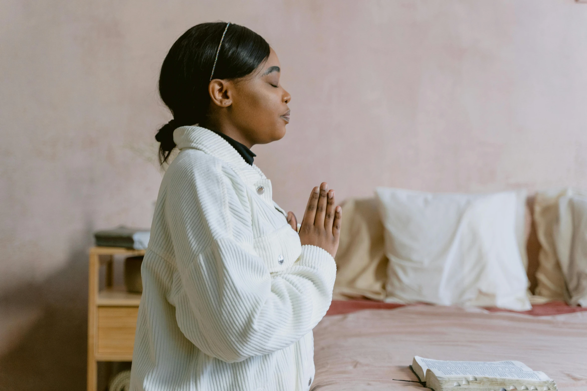 the woman in white is meditating her own body