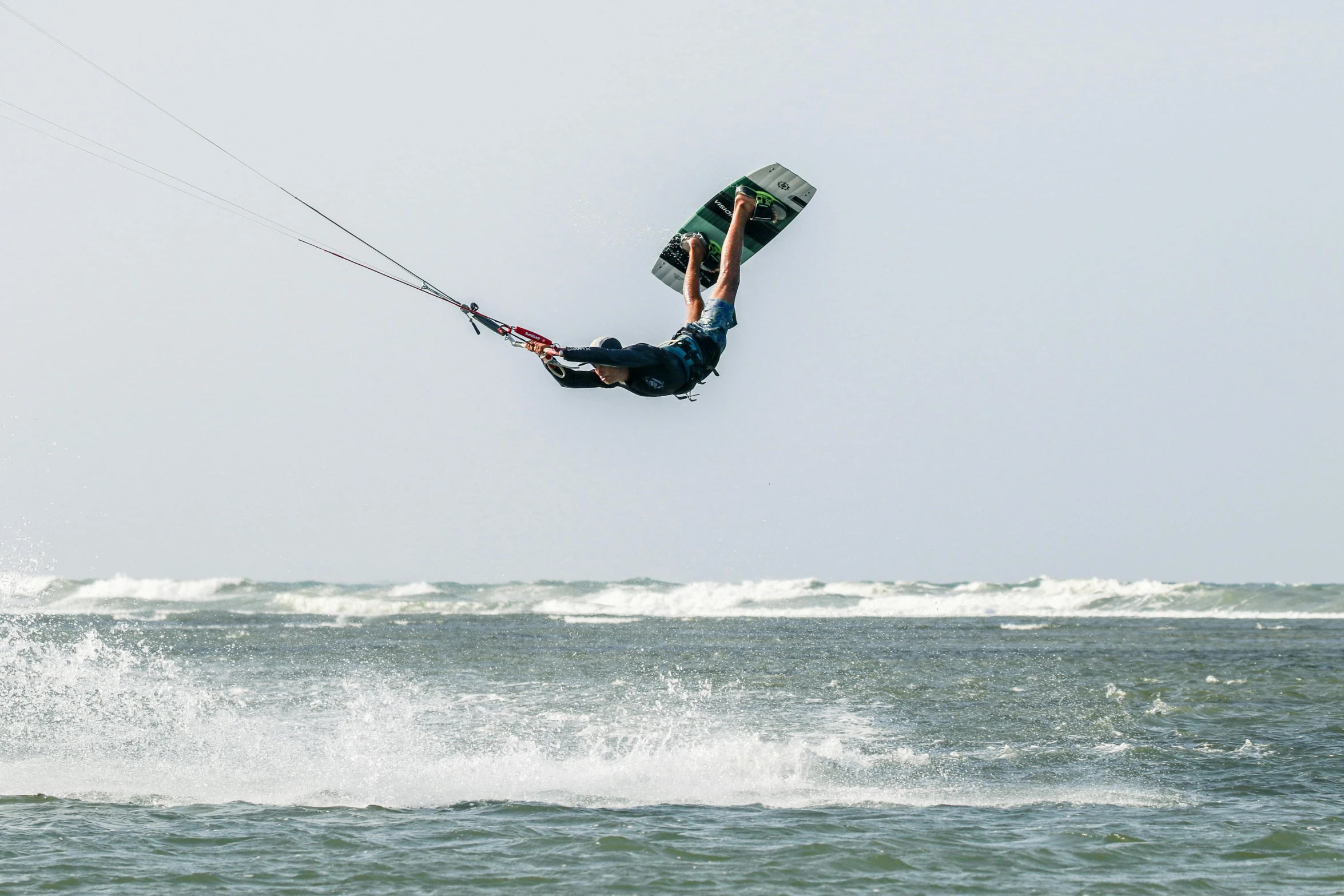 a man flying through the air while riding a board