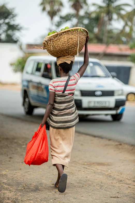 a woman with a basket on her head