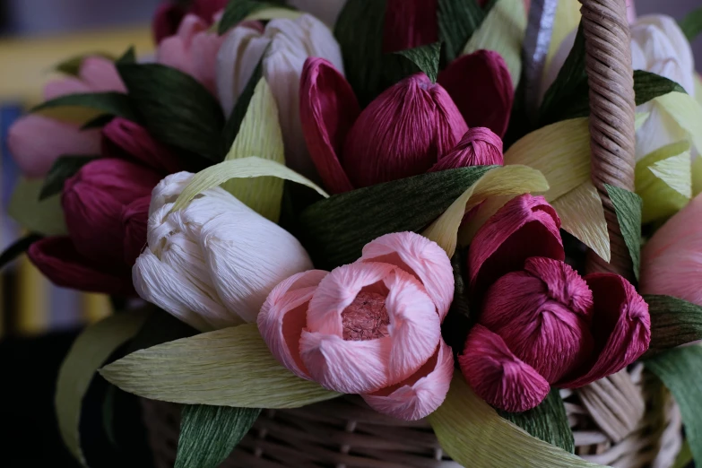 the flowers are arranged in a basket ready to be put in