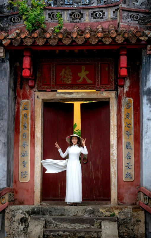 woman standing outside doorway in ancient chinese style