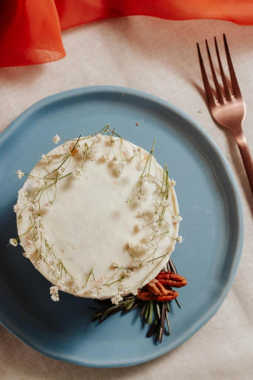 a plate with a cake on it next to a fork