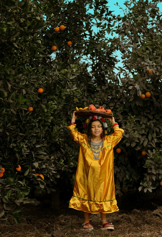 a little girl standing in the middle of some trees