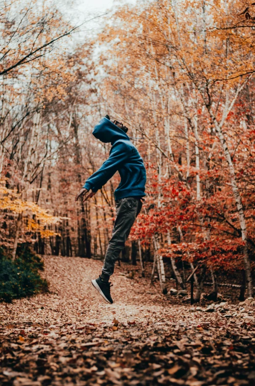 a man jumping in the air with his skateboard