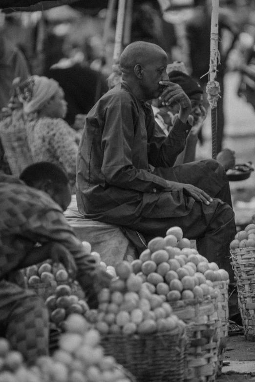a black and white po of people near many baskets of food