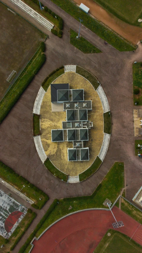 a round structure sitting in the middle of an open field