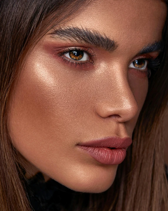 a woman with long hair wearing makeup on her face