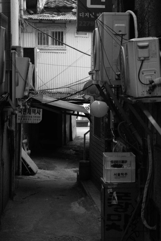 a black and white pograph of an alley way