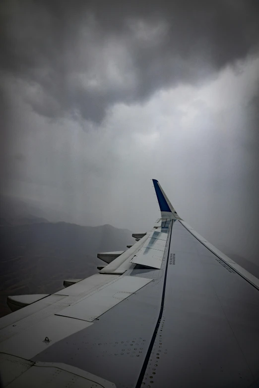 a jet liner wing on an airplane in the sky