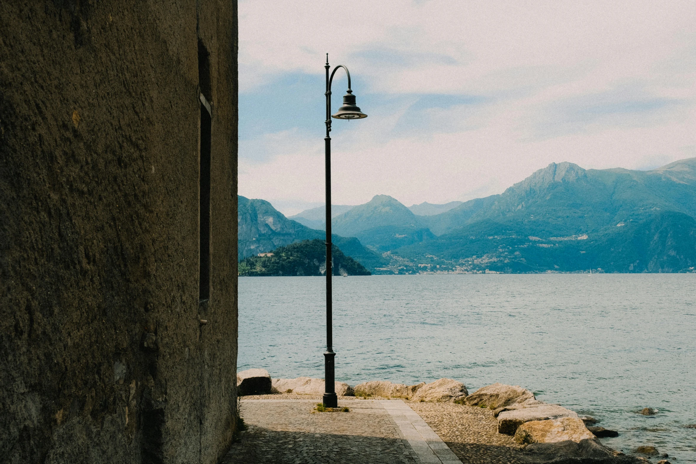 a street light with an island in the background