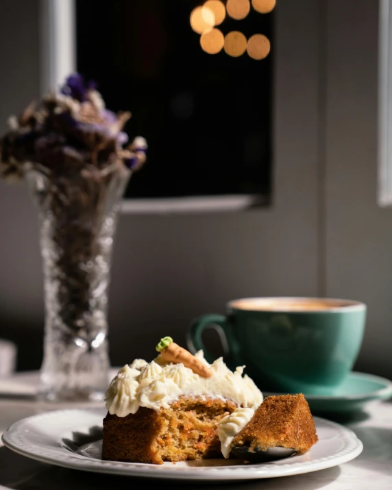 a plate with cake and a cup of coffee on it