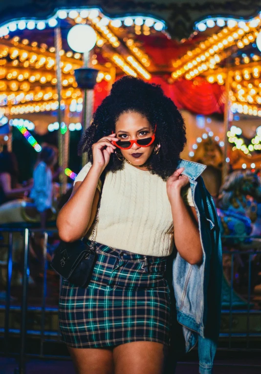 a woman in a plaid shorts at the carnival