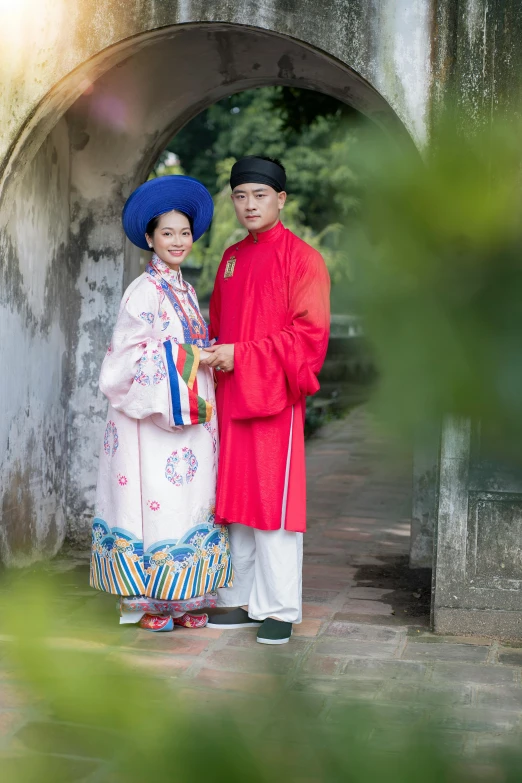 an asian couple standing next to each other