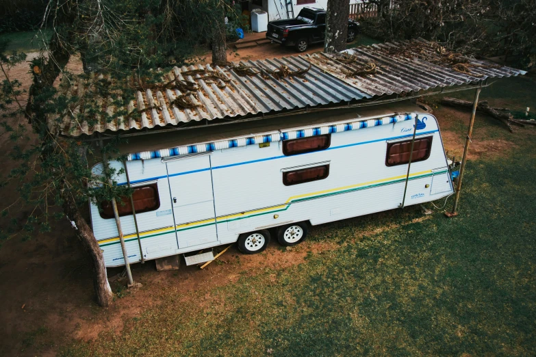 a trailer that is parked in the grass