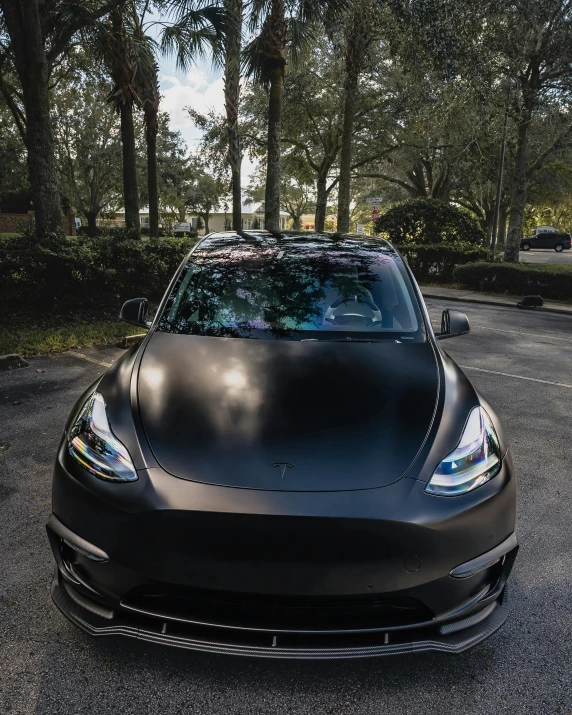 the new black tesla car has a hood covered up